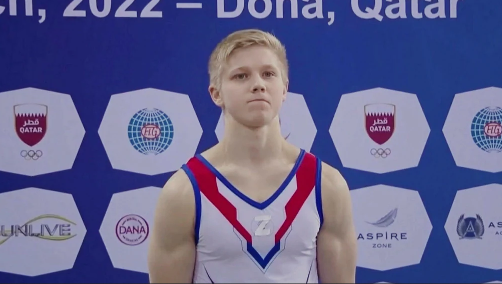 Gymnast Ivan Kuliak stepped up on the podium after a competition in Doha with a Z taped to his chest.